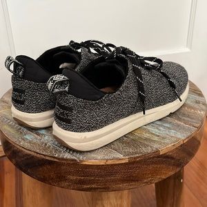 Toms lace up sneakers.